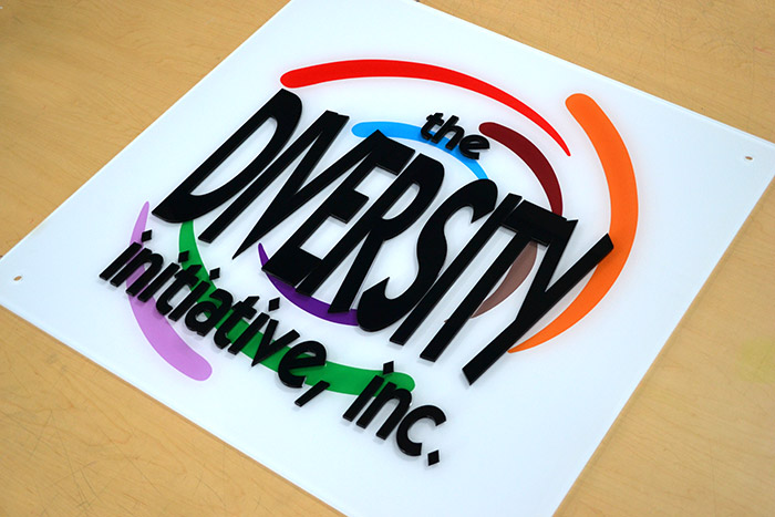 "The diversity initiative, inc." panel signage