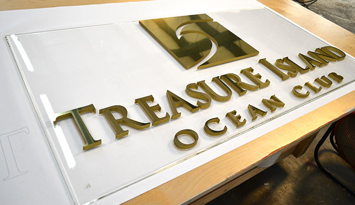 "Treasure Island Ocean Club" channel cut letter on clear acrylic backing 