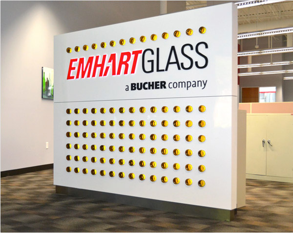 final logo wall with light feature "Emhart glass"