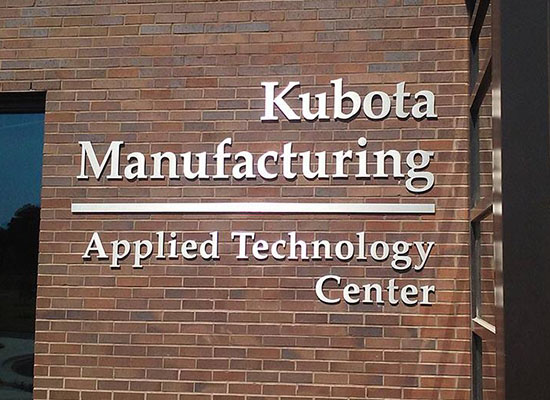 "Kubota Manufacturing" Flat Cut & Rounded letters